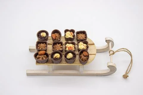 Few chocolates candy stand on sledge Stock Photos