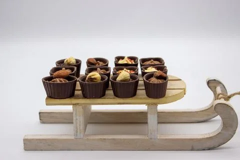 Few chocolates candy stand on sledge Stock Photos
