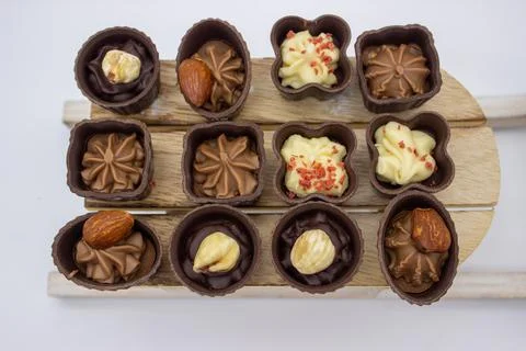 Few chocolates candy stand on sledge Foto stock