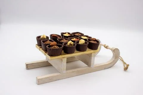 Few chocolates candy stand on sledge Stock Photos