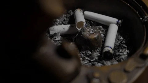 A few cigarettes are in the ashtray Stock Footage 119069145