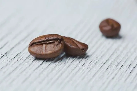 Few coffee beans, grain structure, internal organs, macrophotography on old w Stock Photos