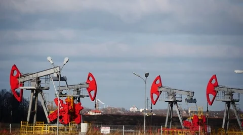 Few colored oil pumps work time  lapse with blue sky background Stock Footage 46949396