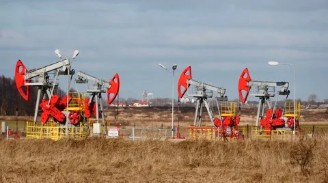 Few colored oil pumps work  with blue sky background Stock Footage 46949423