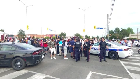 Few cops for too many protesters when rally parties start to surround the 5-0's Stock Footage 133975194