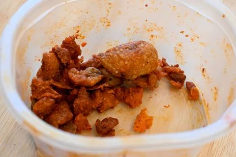 Few cracklings in plastic container cost of living crisis Stockfoto's
