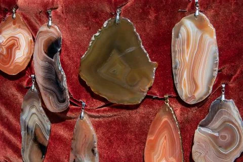 Few different beautiful flat polished agate pendants Stock Photos