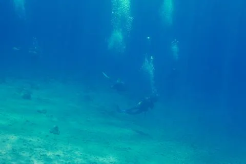 Few divers in deep water Stock Photos