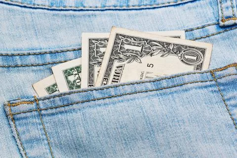 Few dollar notes in jeans pocket Foto stock