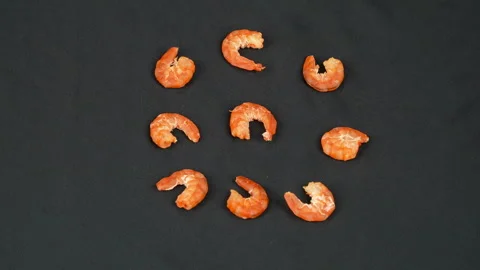 Few Dried Shrimps Rotating On Black Background Top View Stock Footage 337780599