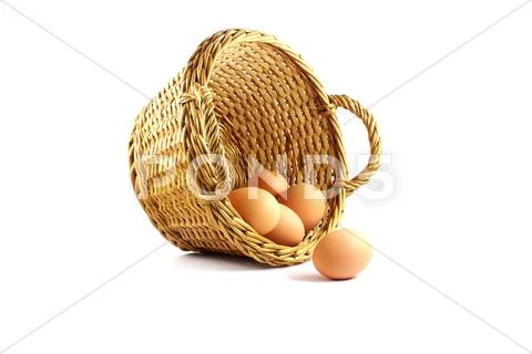 Few eggs in a basket Stock Photos