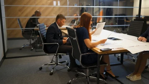Few employees work with documents and drawings in modern office. Stock Footage 102503229