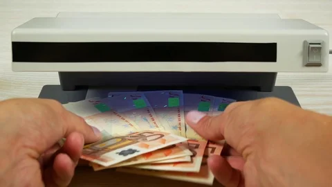 A few euro notes in hand. Check on the currency detector. Stock Footage 79034959