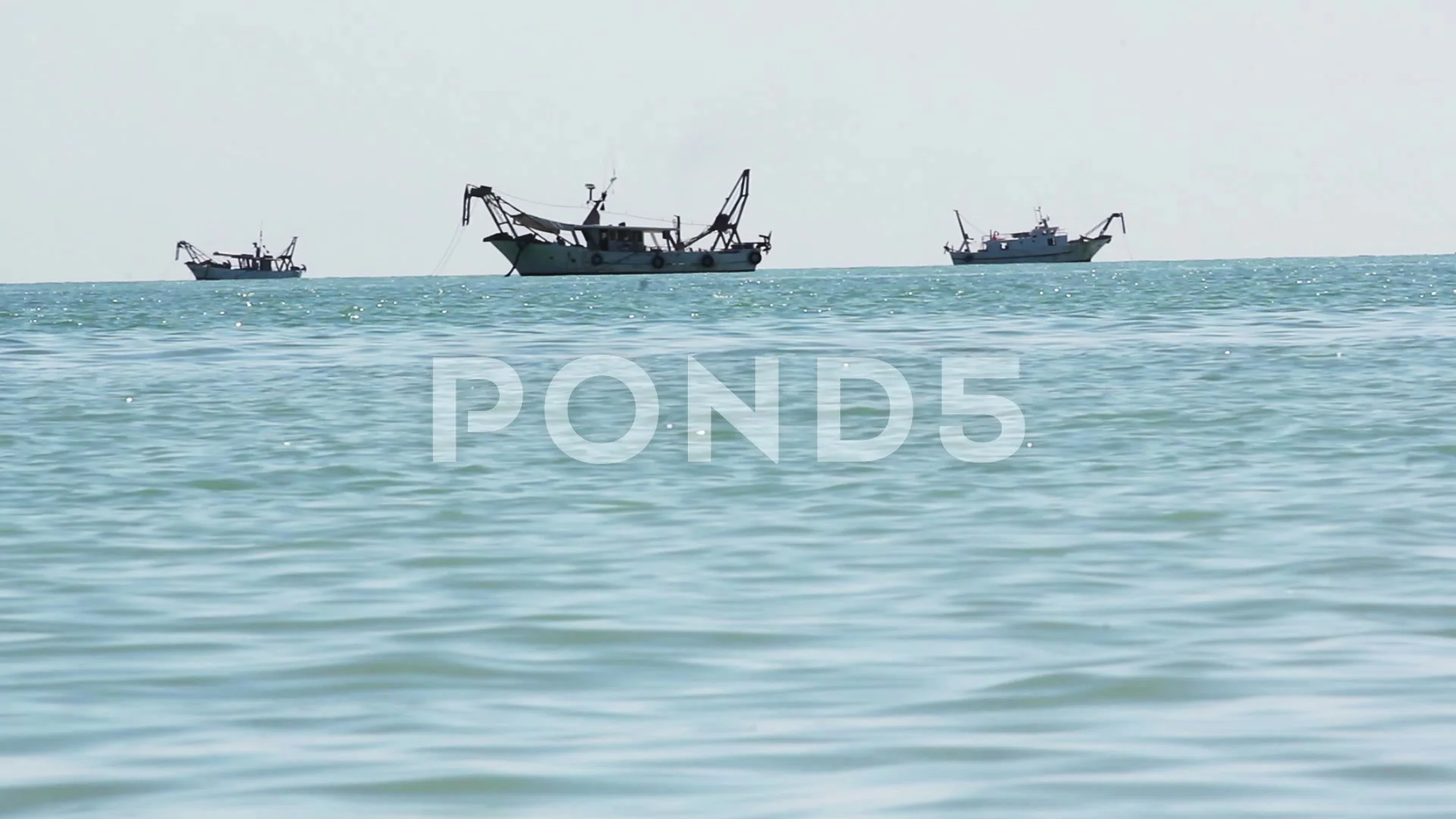 a few fishing boats to the horizon . dee, Stock Video
