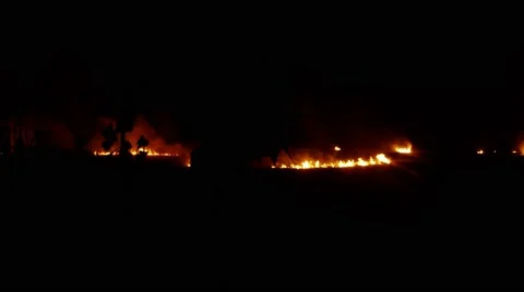 Few Hearths of Fire in the Darkness in Distance Stock Footage 66065165