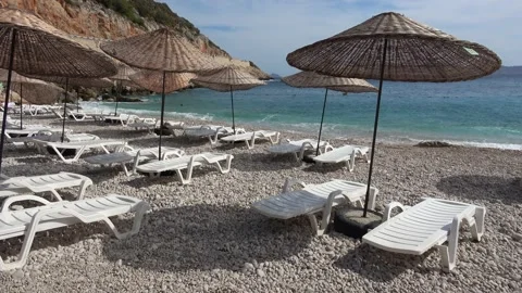 Few holiday makers on the empty beach one stormy day 2 Stock Footage 194289512