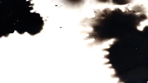 Few ink blots spreading on white background Stock-Footage 147703073