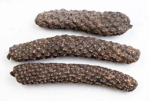 Few java long peppers close up on gray few java long peppers close up on g... Photos