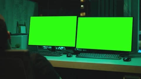 Few monitors with green screen in dark m... | Stock Video | Pond5