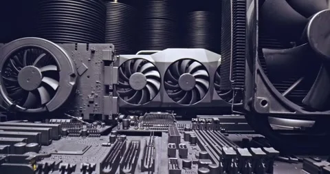 Few motherboards holding CPU, GPU and cooling fans. Stock Footage 336014641