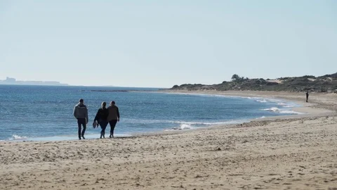 Few people on the beach Stock Footage 89684288
