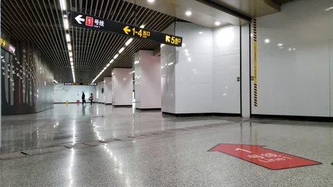 Few People Pass by Empty Subway Station in China Due to Corona Virus Quarantine Stock Footage 124678044