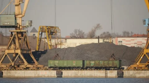 Few port cranes unloading wagons wit bulk bulk materials time lapse close up Stock Footage 48119273