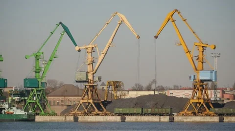 Few port cranes unloading wagons wit bulk bulk materials time lapse Stock Footage 48119283
