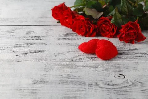 Few red roses on white table Stock-Fotos