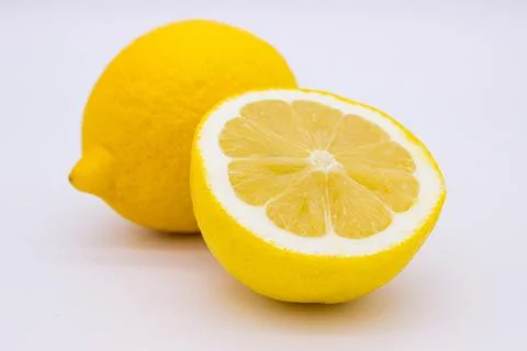Few ripe lemons on light background Stock Photos