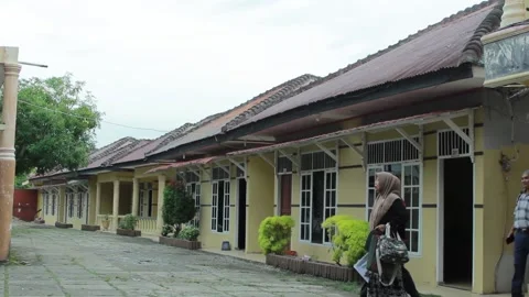 A few simple hotel rows and seen some people walking Stock Footage 195948943