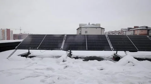 The few solar panels were installed on the roof of building in winter season Stock Footage 259208074