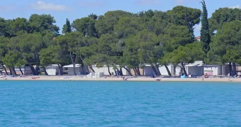 Few tourists on an empty beach. Stock Footage 132730145