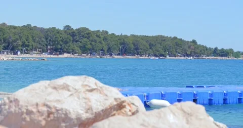 Few tourists on an empty beach. Stock Footage 132730386
