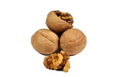 A few walnuts in a scrap and a kernel on a white background Foto stock