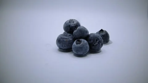 Few water drops falling on top of the blueberries Stock Footage 232967043