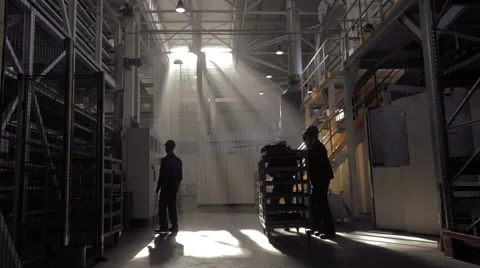 Few workers in rays of light Stock Footage 62086042
