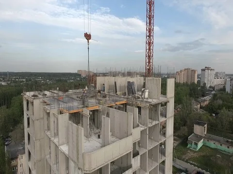 A few workers working on the construction of block houses Stock Footage 76103104