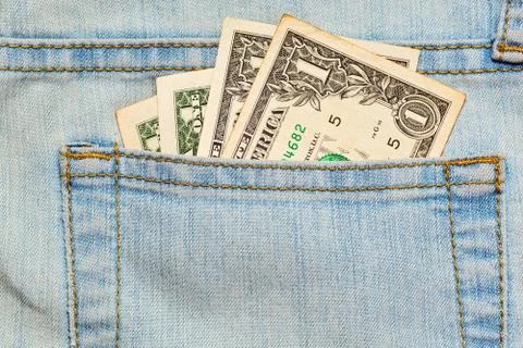 Few worn US dollars notes in jeans pocket Stock Photos