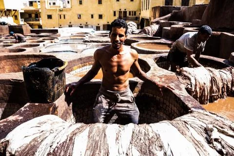 Fez - Morocco - September 29, 2018: Men working in the leather tanneries in Fez, Stock Photos
