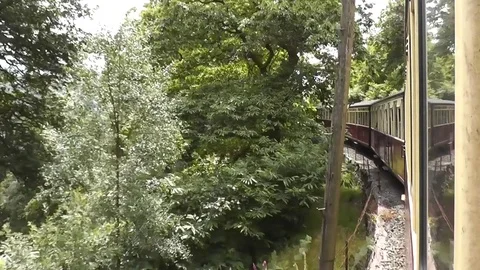 Ffestiniog Railway - view from window on tight superelevated curve Stock Footage 79960529