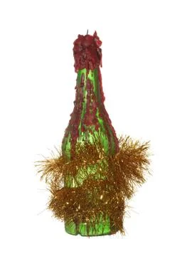 Ffloating red candle on an empty green bottle decorated with a festive garlan Stock Photos