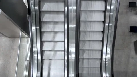 FHD video of moving up and down escalator in a shopping center, subway or Stock Footage 134012236