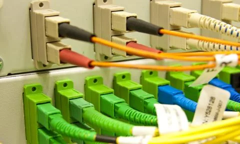 Fiber cables connected to servers Stock Photos