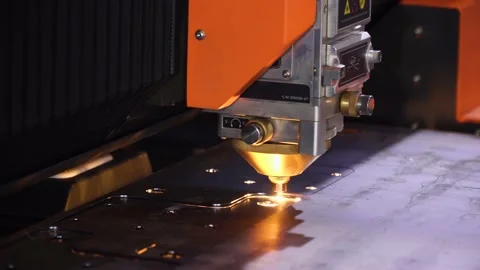 Fiber laser cutting CNC machine cuts metal list close-up. Making metal part. Video stock 143334045