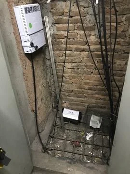 Fiber Optic Box and Pest Control Trap in Utility Space Stock Photos