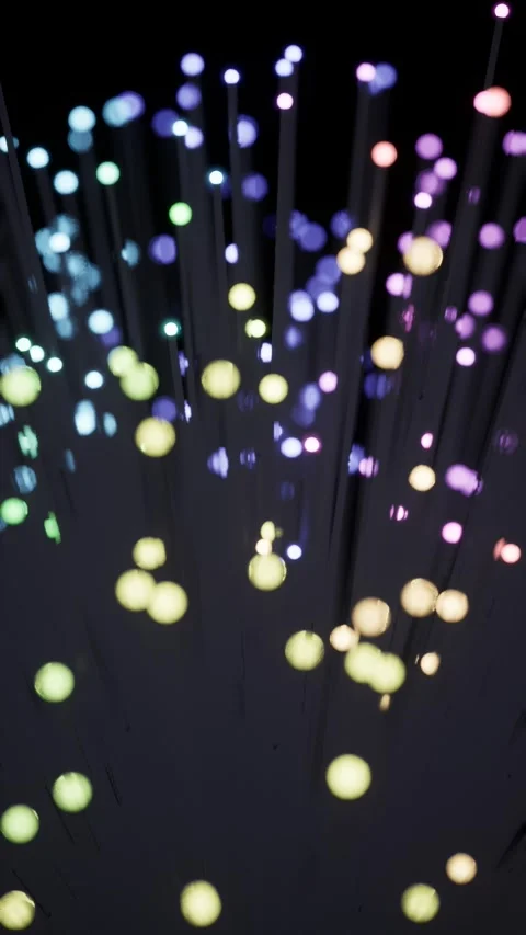 Fiber optic bundle with glowing tips and bokeh, rainbow tones Vidéo 348800361