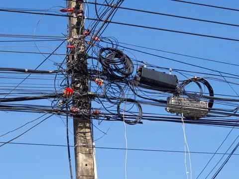 Fiber optic cable on electric pole in thailand Stock Photos