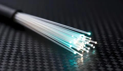Fiber Optic Cable Glowing on Black Carbon Fiber Background Stock Photos