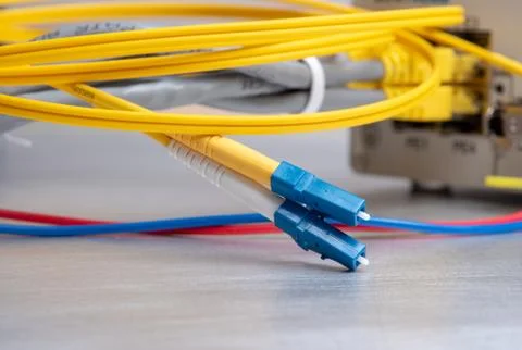Fiber optic cable patch cord used at installation high speed gigabit equipment Stock Photos